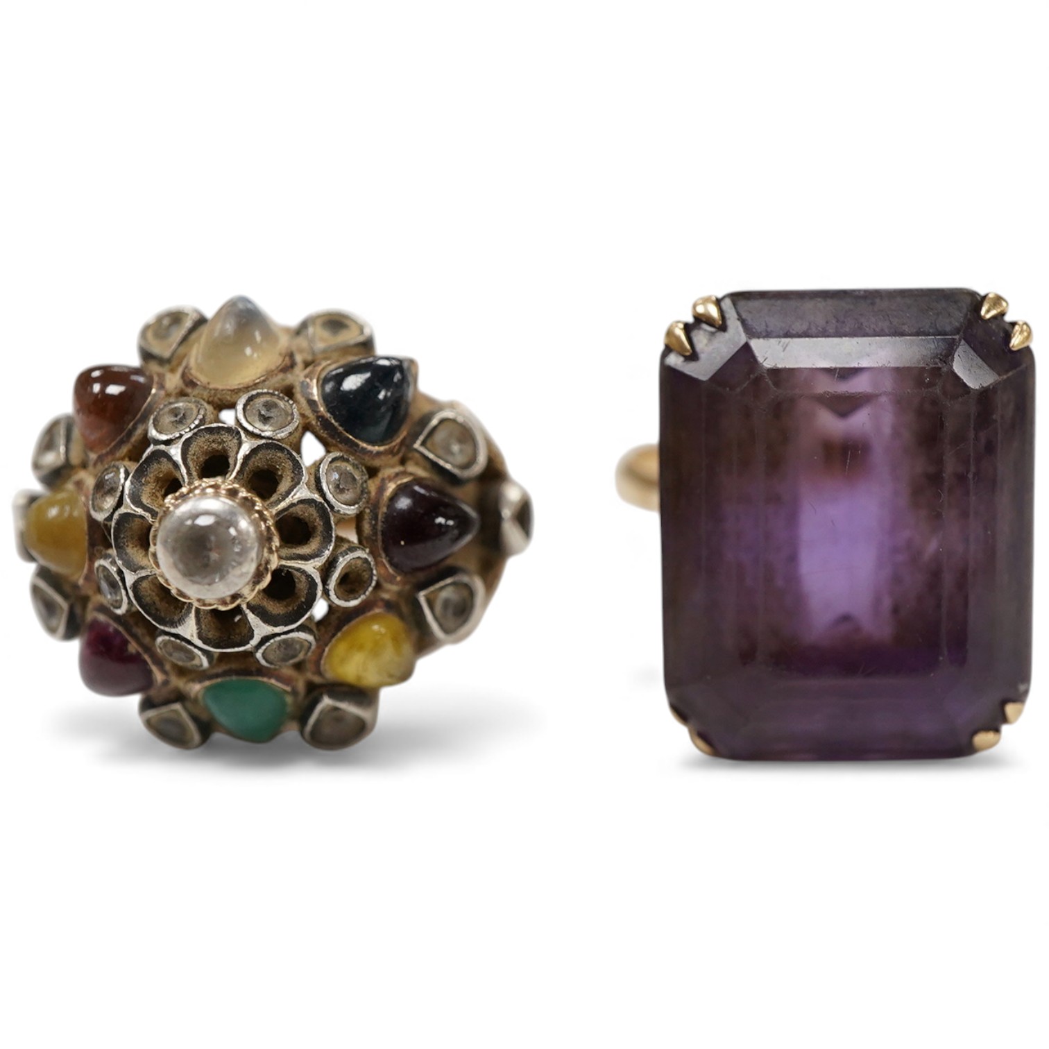 A yellow metal and single stone emerald cut amethyst set dress ring, size Nm together with an Indian? yellow metal and multi gem set ring.